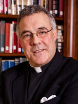 [Photo of Father Robert A. Sirico]